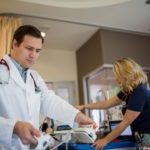 Dr Simon Oczkowski in a hospital room