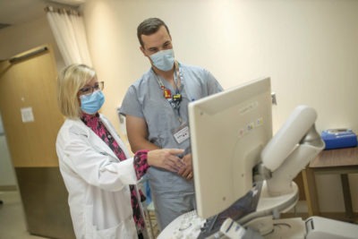 Dr. Karen Finlay and colleague looking at a computer screen