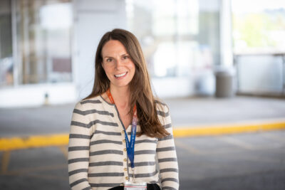 Headshot of Mary Van Impe outside of McMaster Children's Hospital